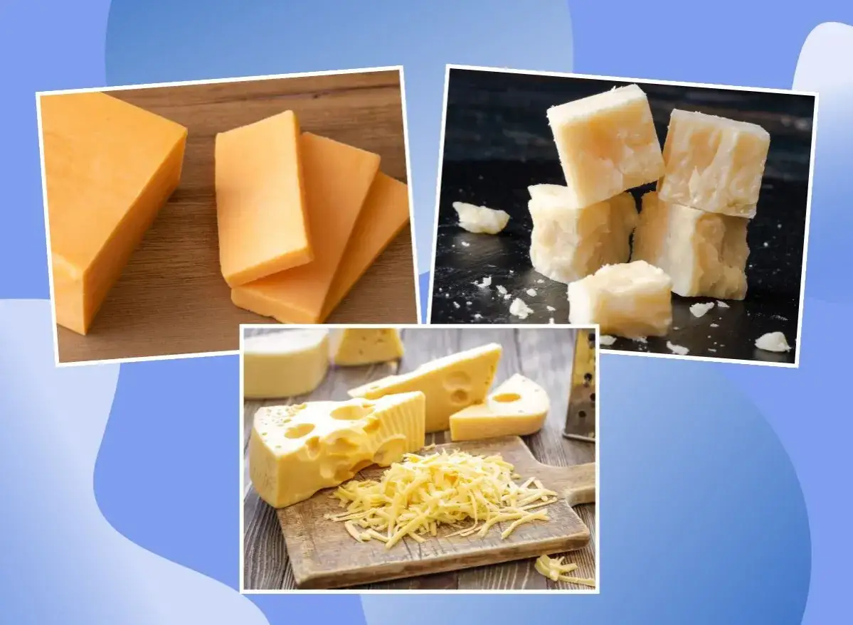 Pomarańczowe i żółte sery, w tym parmezan, na desce. Szukasz, jaki ser ma najmniej kalorii?